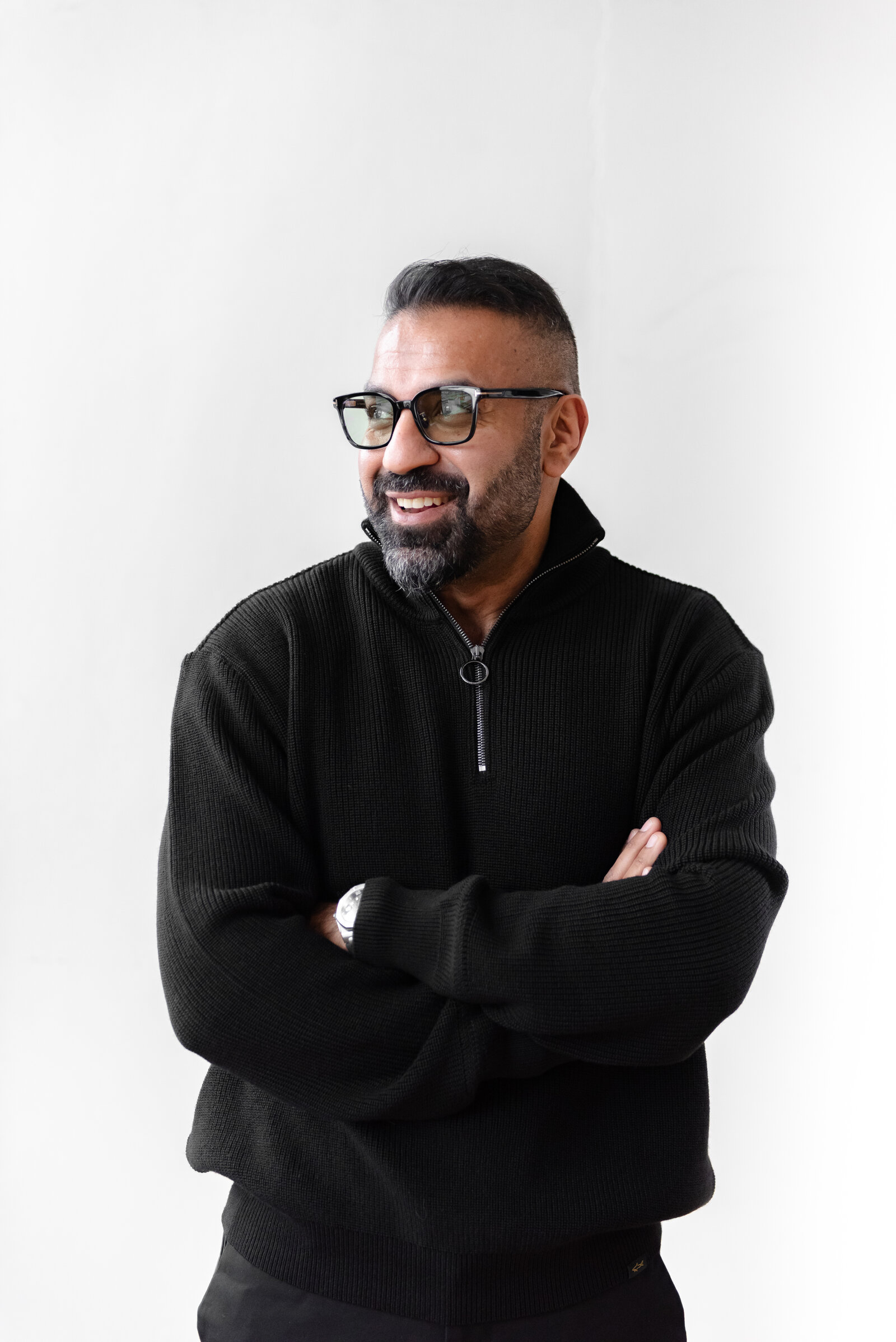 Nauman Khan — Growth Operator, confident portrait with arms crossed